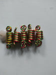 red gold and green dreadlock coils